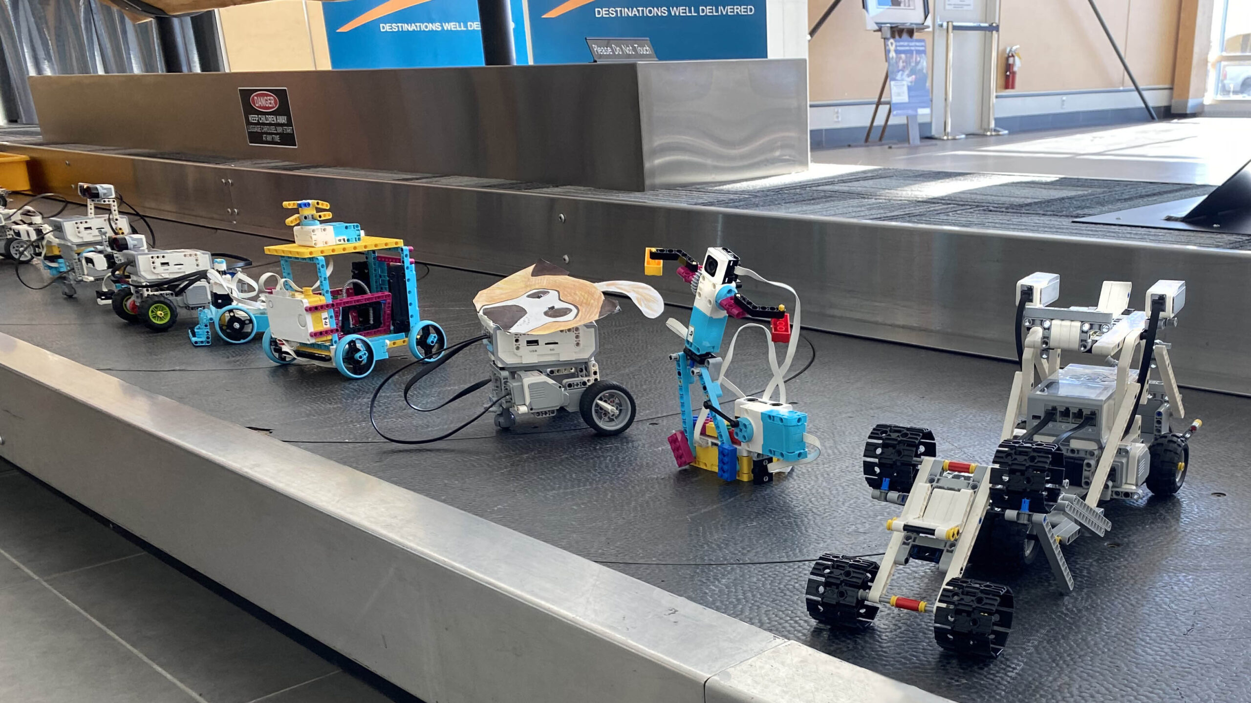 Robots made of Lego on a baggage carousel at Kamloops Airport. 